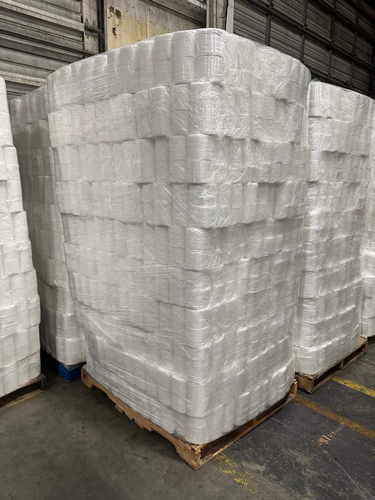 Warehouse aisle filled with wholesale pallets