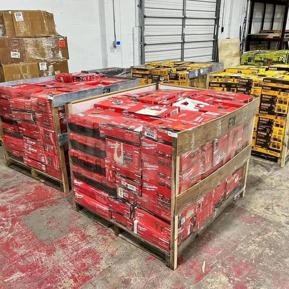 Worker loading a pallet into a delivery vehicle