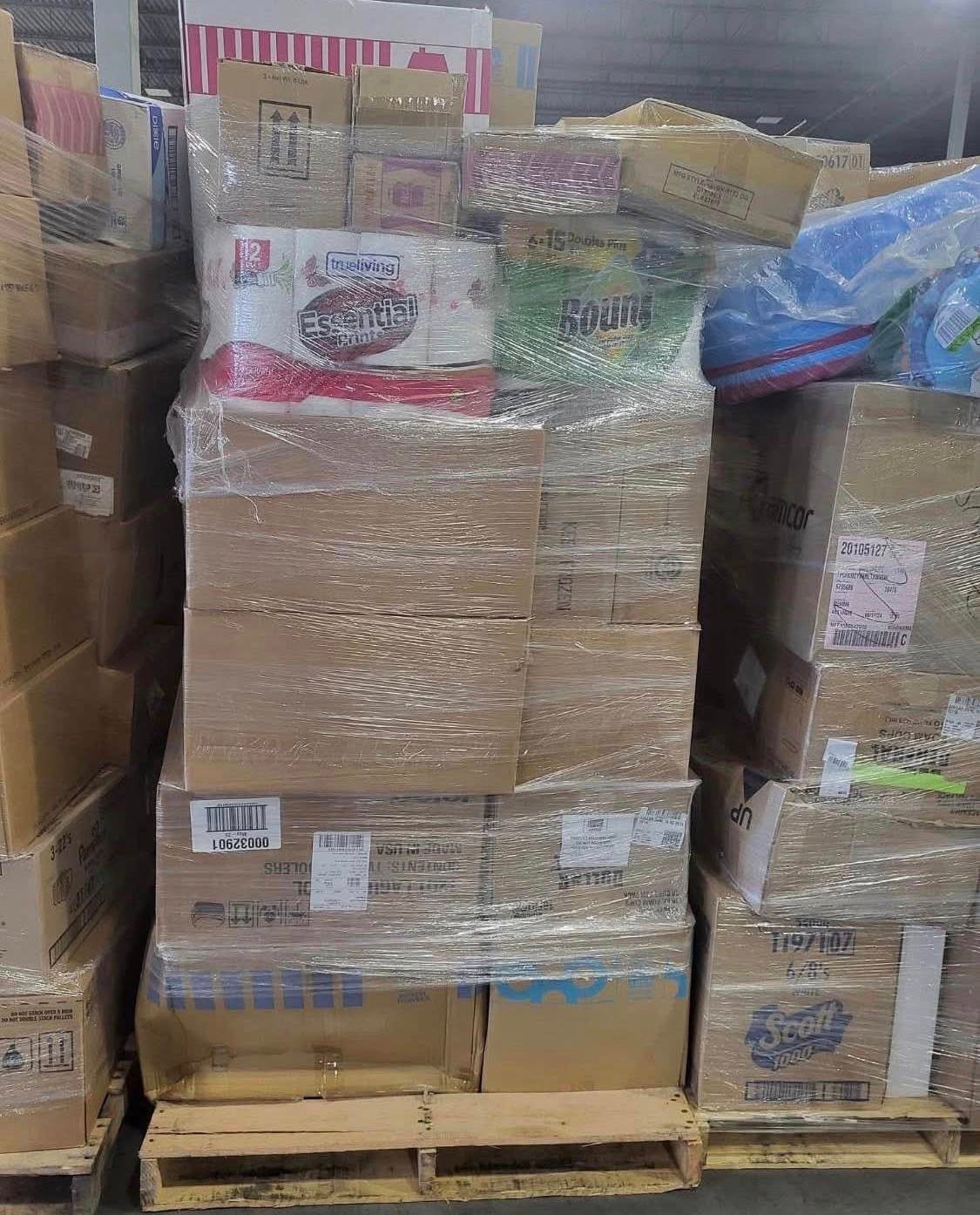 Wholesale pallet lot staged near a loading dock