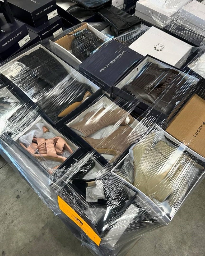 Wholesale pallet lot staged near a loading dock