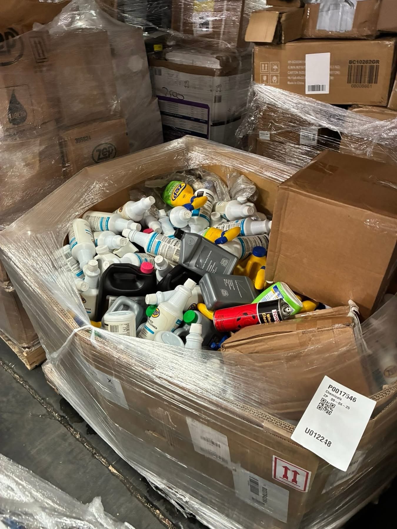 Reseller inspecting a liquidation pallet